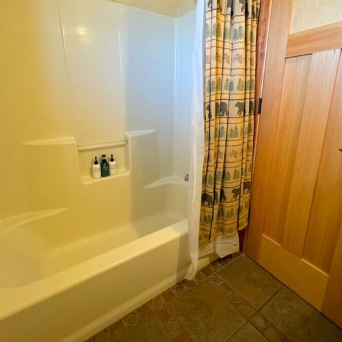 Downstairs also enjoys a full bathroom, with large tub/shower combo.