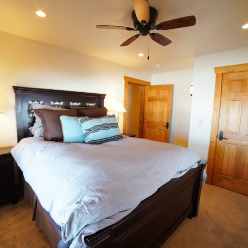 Bedroom #3, located in the basement, has a queen bed and great closet space.