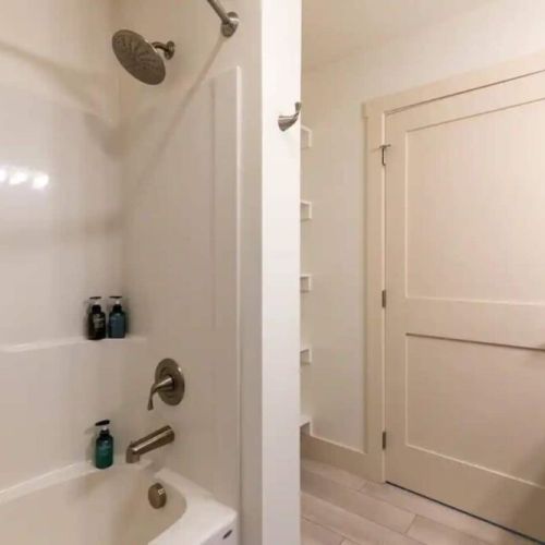 The second bathroom also enjoys a large vanity, as well as a  large tub/shower.