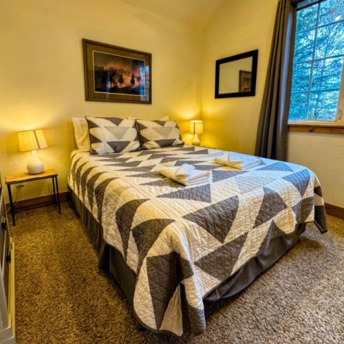 Bedroom #2 has a queen bed, and also enjoys a dresser and a large closet.