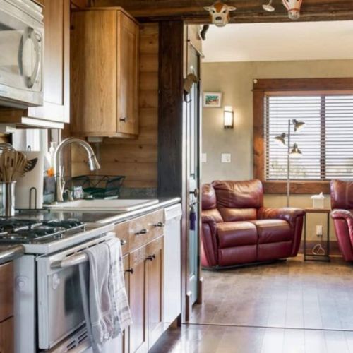 The kitchen enjoys easy access to both the living and dining areas.