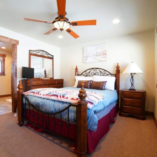 Bedroom #2 has a queen bed and an en suite bath — as well as a view of the Tetons.