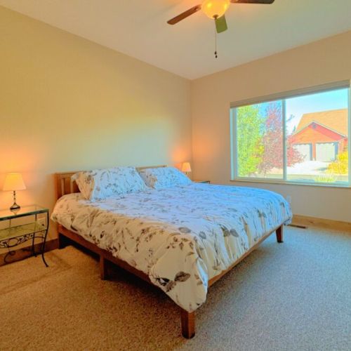 Bedroom #2 has a king bed and a lovely view of the front yard.
