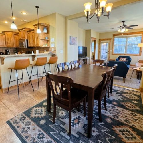 Chat at the island, lounge in the living room, or eat at the dining room table — this space is perfect for any guest's needs!