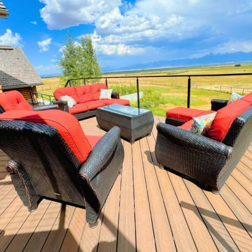 The expansive back deck is the perfect place to hang out with family, cook on the grill, and enjoy the spectacular view.