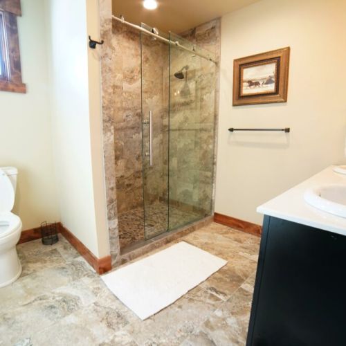 The upstairs hall bath has a double vanity and large walk-in shower.