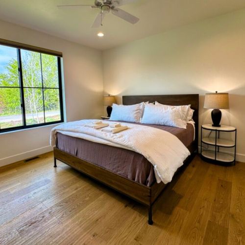 Bedroom #2 (ground floor) has a king bed, views of the front of the home, and its own en suite bathroom.