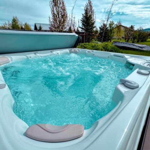 Luxuriate in the hot tub, located in the backyard.
