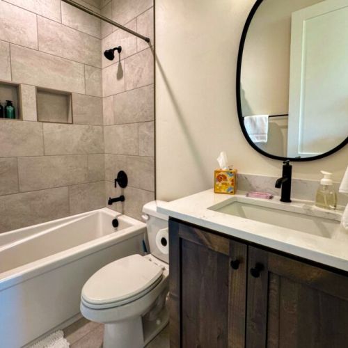 Bedroom #2's en suite has a vanity and a tub/shower combo.