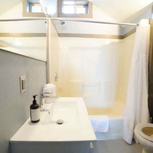 The upstairs bedrooms share a bathroom with a recently remodeled vanity and a shower/tub combo.