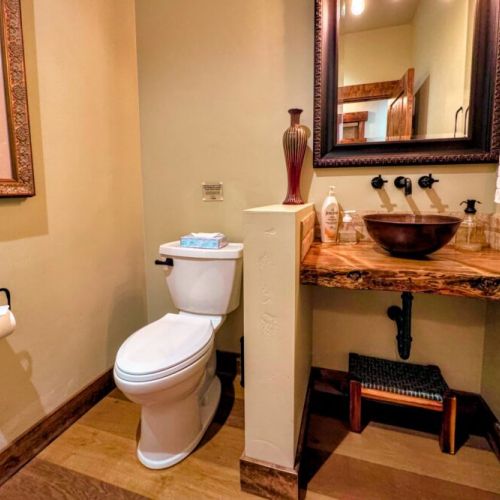 The main level enjoys a convenient powder room off of the living room.