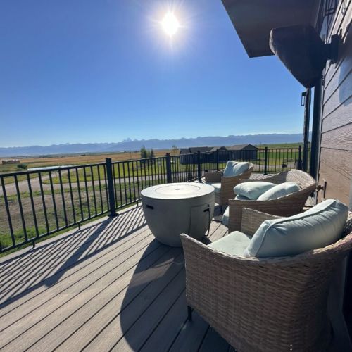 Unwind on the upper deck with comfy seating, a gas fire pit, and a view of the Tetons.