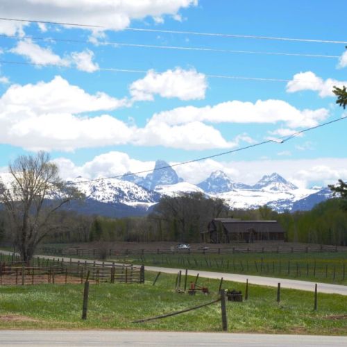 Take in majestic views of the Tetons right off the front porch.