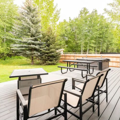 When you aren't soaking in the hot tub, you can relax in the outdoor chairs or enjoy an al fresco meal.