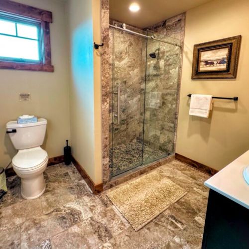 The upstairs hall bath has a double vanity and large walk-in shower.