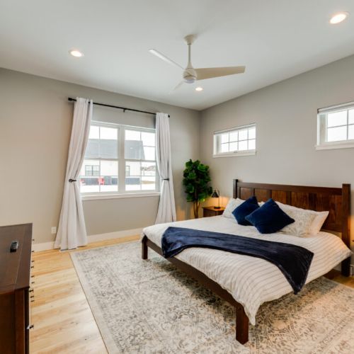 The primary bedroom features a king bed and a large en suite bathroom.