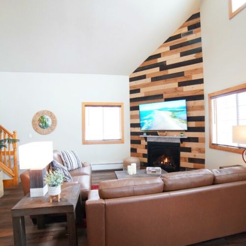 Kick back and relax in the living room, taking advantage of the cozy seating, gas fireplace, and a large TV.