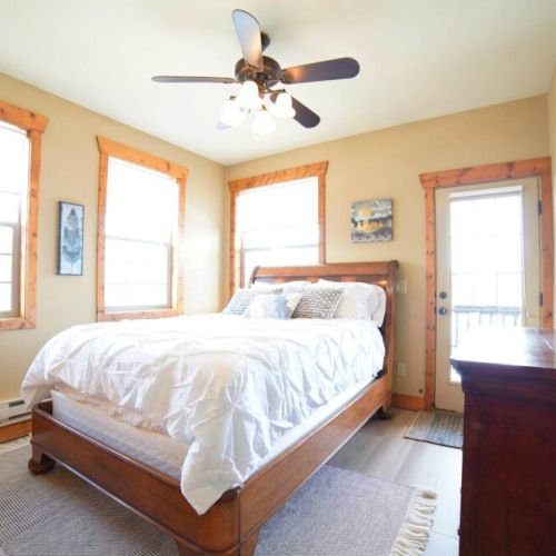 Bedroom #2 has a comfy queen bed, a large closet, and access to a balcony shared with Bedroom #3.