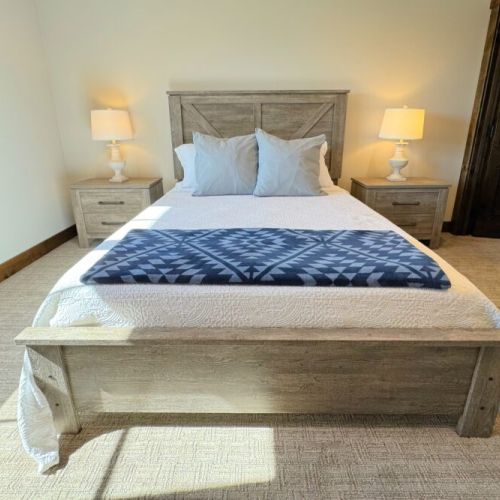 Bedroom #2 enjoys a queen bed and a walk-in closet, as well as access to a Jack-and-Jill-style bathroom.