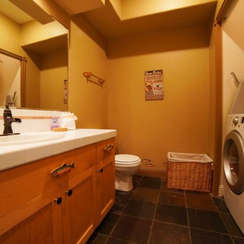 The 1st floor powder room is also home to the washer/dryer — we even provide detergent!