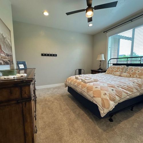 The master bedroom has a queen bed and an en suite bath.