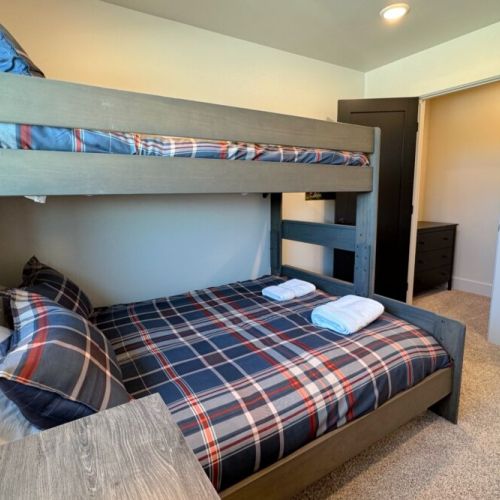 Bedroom #3 has a twin XL-over-queen bunk bed, as well as its own workstation with a computer monitor.