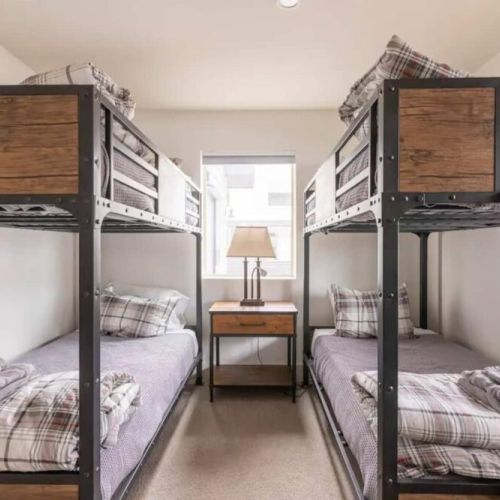 Bedroom #2 has two twin-over-twin bunk beds, made in an attractive mountain modern style.