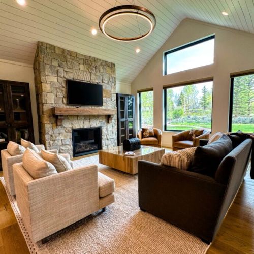 Kick back and relax in the living room, taking advantage of the inviting seating, a large smart TV, and a cozy gas fireplace.