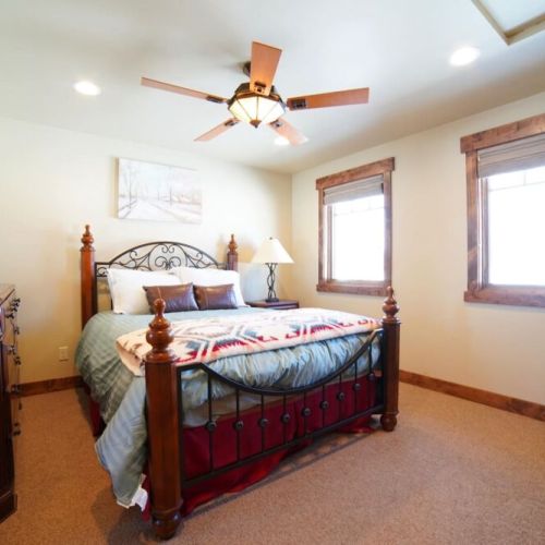 Bedroom #2 has a queen bed and an en suite bath — as well as a view of the Tetons.