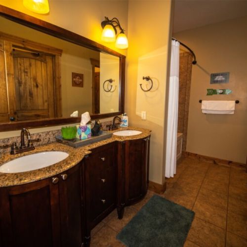The master en suite has a double vanity and a large tub/shower combo.