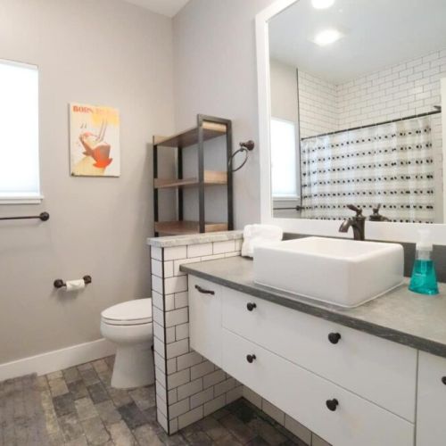 Bedrooms #2 and #3 share a bathroom with a large tub/shower combo.