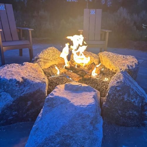The outdoor fire pit offers a cozy, relaxing option for unwinding.